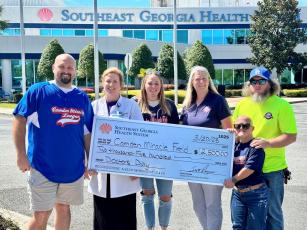 Southeast Georgia Health System recently donated $2,500 to the Camden Miracle League. From left are Camden Miracle Field board president Dillon Lacoste, Southeast Georgia Health System Camden Campus’ Dr. Janise H. Whitesell, Camden Miracle Field’s board members Nicole Ludwig and Sarah Johnsen, and Buddy Dan Fredericks and Lisse Nettles.