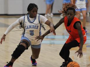 A loose ball gets the full attention of Camden’s J’Mya Albertie in the Lady Wildcats’ home win over Johnson. (Andy Diffenderfer, Tribune & Georgian)