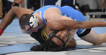 Camden County’s Tripp Fletcher pinned Valdosta’s Karl Rosip last Saturday at the Region 1-7A duals. Camden easily retained the title and will compete at state this weekend in Buford. (Andy Diffenderfer, Tribune & Georgian)