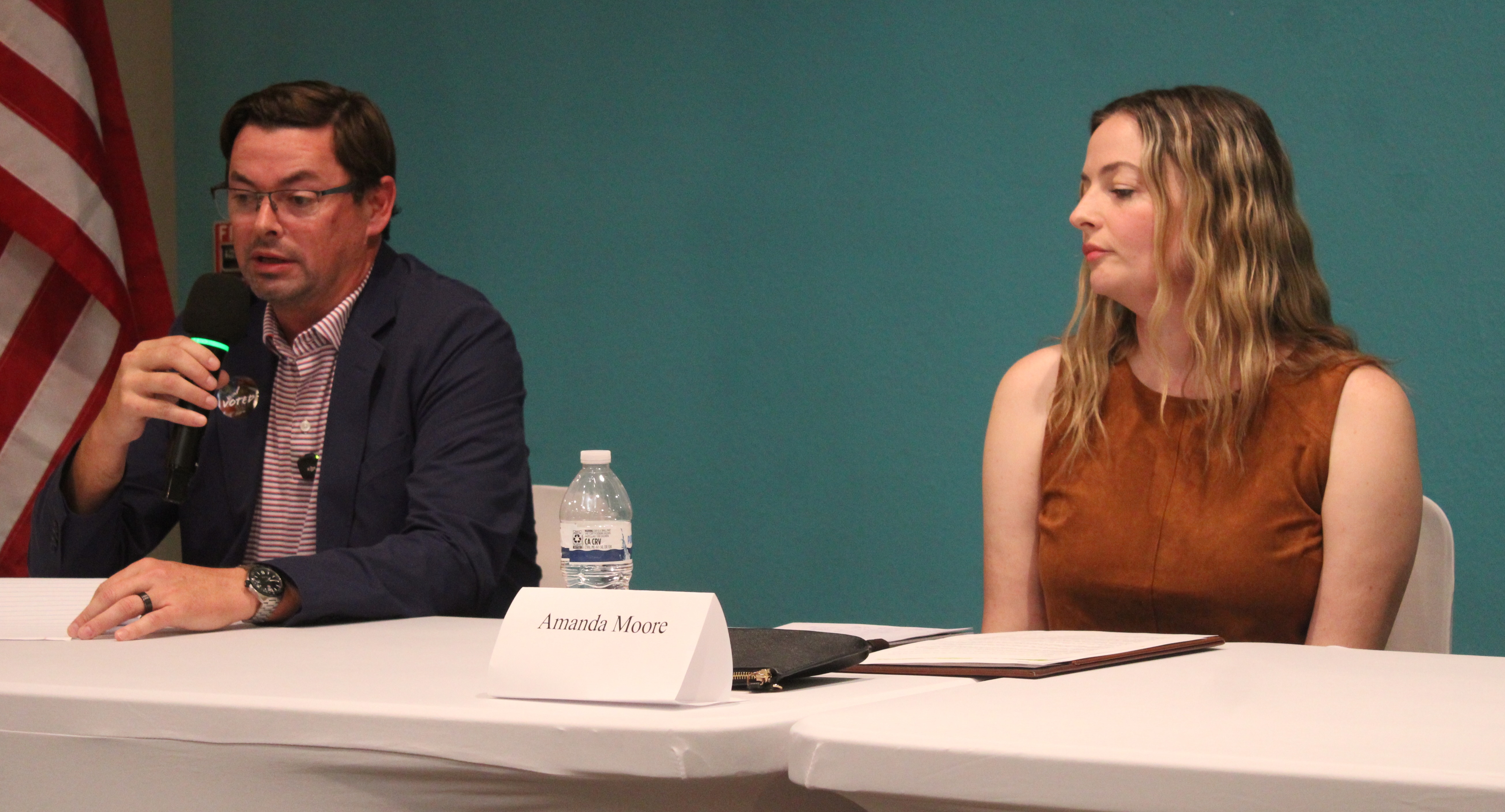 St. Marys Councilman Chad Ingram, left, and challenger Amanda Moore discuss city issues during the Tribune & Georgian’s candidate forum Tuesday. The two are running for the Post 3 seat on Council.