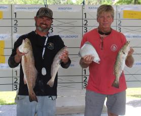 Jimbo Johns and Ricky Sparkman (above photo) display their catches. (Andy Diffenderfer, Tribune & Georgian)