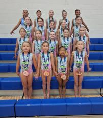 On the front row are Kyleigh Richmond Morris, Tinsley Murphy, Heiress Raven, Luci Harris; second row, Blythe Crabb, Camille Valot, Penny Bardun, Raelyn Taylor, Emory Mobbs; third row, Ella Mobbs, Emmalyse McLaws, Mikayla McLaws, Stella Smith, Kaston Brimhall; back, Izzy Simbras, Morgan Watts, Elin Runnels, Bella Raleigh, Arianna Light. Not pictured are Ally Black and Amelia Black. (Andy Diffenderfer, Tribune & Georgian) 