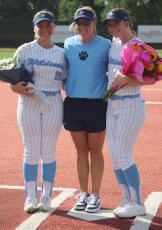 Piper Petrine (left) and Rylee Yarborough (right) were honored in pregame Senior Night festivities. They are with CCHS head coach Kayla Miller. (Andy Diffenderfer, Tribune & Georgian) 