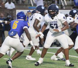 The Wildcats’ Kaiden Chever faces off with Brunswick’s Braylen Johnson. (Scott J. Bryan, Tribune & Georgian)