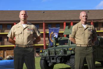 Marine Corps Security Force Battalion (MCSFBn) Kings Bay, newly pinned sailors and Marines stand at attention during a Chief Petty Officer pinning ceremony at MCSFBn Headquarters on Naval Submarine Base Kings Bay.