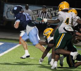 Jesse Newsome runs for an early touchdown against Ed White last Friday. (Andy Diffenderfer, Tribune & Georgian)