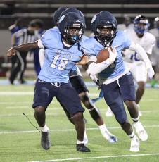 Cedric Davis (with Glonger Carter) had a big interception in the Wildcats' win over Godby. (Scott J. Bryan, Tribune & Georgian)