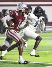 The Wildcats’ Cedric Davis pursues Lowndes’ Kaevone Thomas. (Scott J. Bryan, Tribune & Georgian)