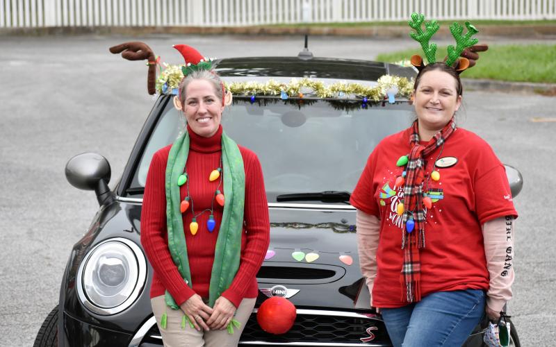 Camden library director Mellissa Clark (right) and children’s specialist Rachael Atterbery decked out themselves and “the holiday gram mobile” last week to deliver holiday cards to every senior facility in Camden County. They’d hoped to get 250 cards, so that each senior would get one. But the kindness of others surprised them as card after card came in until they had more than 1,000 to share.