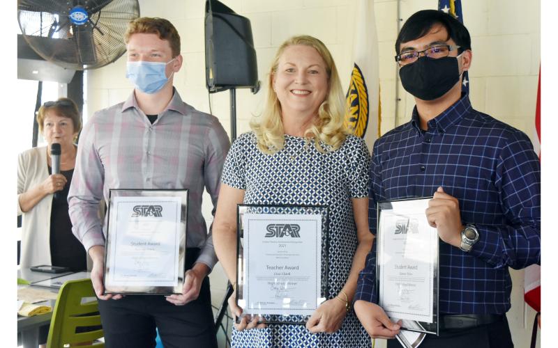 The St. Marys Kiwanis Club recognized two STAR students Monday, Karson Lewis (right) and Aaron Dino (left), for achieving the highest SAT scores. Each students gets to pick a teacher to share the recognition. Dino picked Lisa Clark (center) and Lewis chose Susan McMurray.
