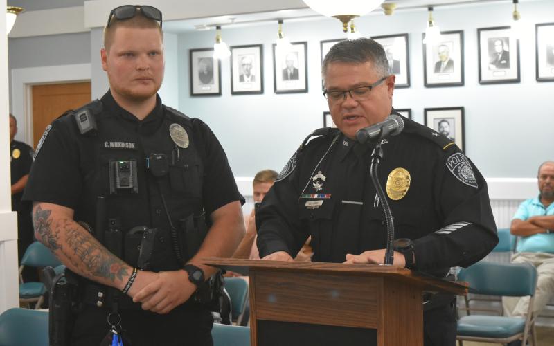 Officer Cameron Wilkinson (left) was recognized for his lifesaving actions.
