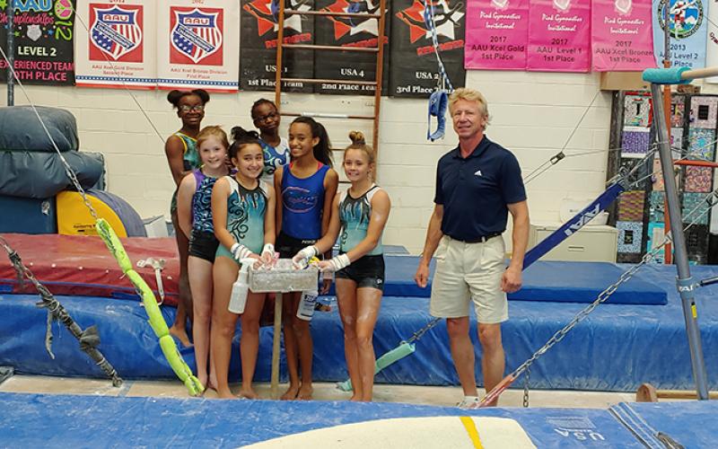 Currently housed in a converted basketball gym, the gymnastics program is anticipating the construction of a new facility dedicated to gymnastics and cheer classes and team formation.