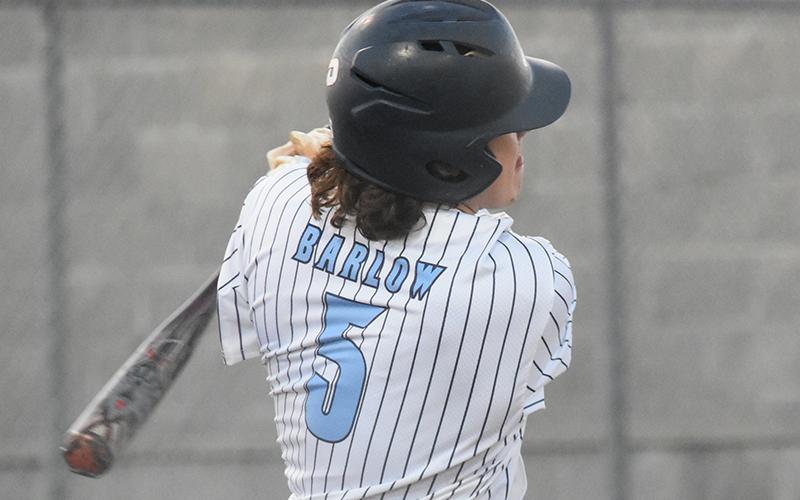Luke Barlow smacks a hit in the Wildcats' win over Grayson. Andy Diffenderfer/Tribune &amp; Georgian