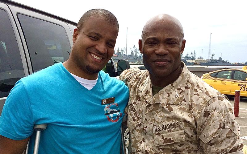 Sergio Rodriguez (left), the Armed Forces Insurance Military Spouse of the Year finalist is pictured with Marine Col. Anthony M. Henderson.