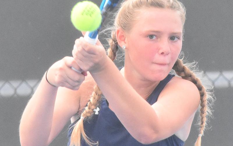 Ashlie Aldridge smacks a backhand in Camden County’s first-round playoff. (Andy Diffenderfer/Tribune &amp; Georgian)