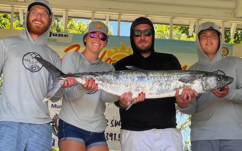 From left are Jon Epstein, Caroline Childress, Robert Southwick and Colton Bartlett with a 28.64-pound kingfish, the largest caught last Saturday at the Historic St. Marys Fishing Classic. (Submitted photo)