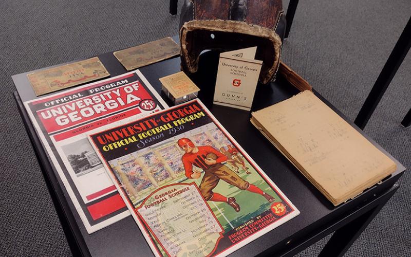 University of Georgia athletics history specialist Jason Hasty brought an exhibit of the school's athletic memorabilia to the St. Marys Library July 27. Among the the treasures were football game programs and ticket stubs dating to the 1920s, including the 1929 UGA-Yale game. (Tribune &amp; Georgian/Andy Diffenderfer)