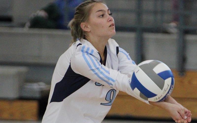 Ansleigh Paul extends the rally in the Lady Wildcats' tri-match Sept. 20. (Andy Diffenderfer, Tribune &amp; Georgian)