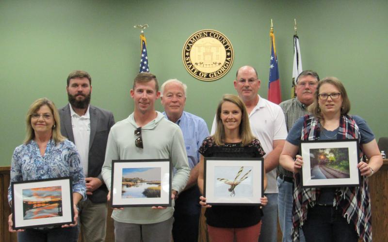 Camden County Photo Contest Winners Frances Lewis, Chandler White, Ashley Rice and Ashley Armstrong pose with their photos and Camden County commissioners.