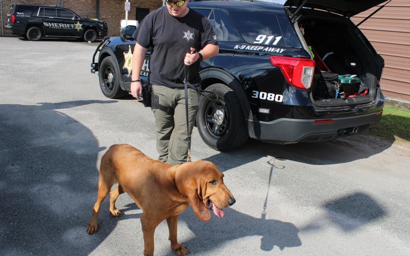 Camden County Sheriff’s Office Sgt. Jay Thames walks his K-9, Jasper, outside the sheriff’s office.