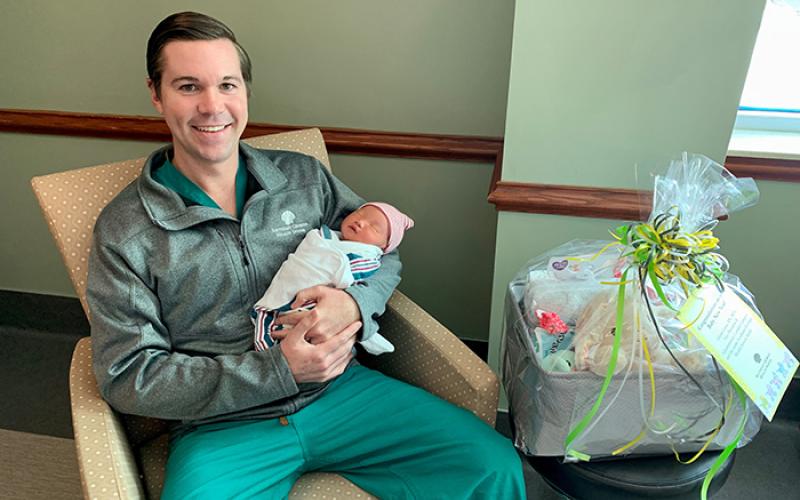 Southeast Georgia Physician Associates-Obstetrics &amp; Gynecology’s Dr. Bradley W. Newton holds Jasper Jiang, Southeast Georgia Health System Camden Campus’ first baby of 2023.