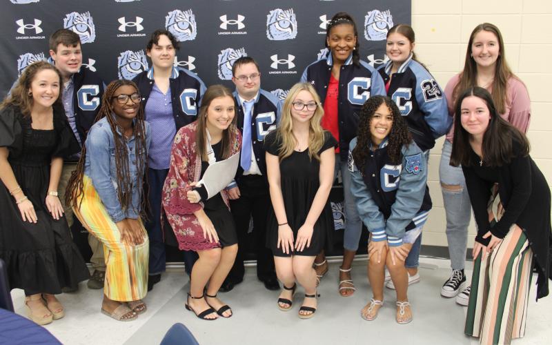 Letter jacket recipients Adam Brewer, Valerie Thompson, Veyonce Covington and Tyson Brodak are with “buddies” Clary Minnick, Zyla Ronan, Riley Copeland, Chloe Moon, Abrianna Antley, Hannah Cassel, Raina Croxton and Natalie Brewer.