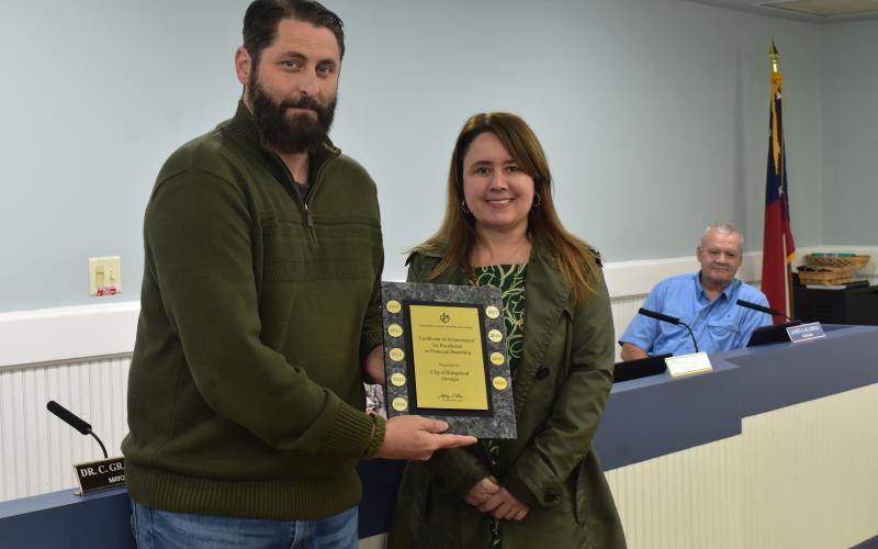 Kingsland Mayor Grayson Day, left, and Kingsland Finance Director Filiz Morrow show off the Government Finance Officers Association Certificate of Achievement for Excellence in Financial Reporting the city was awarded for the 18th consecutive year.