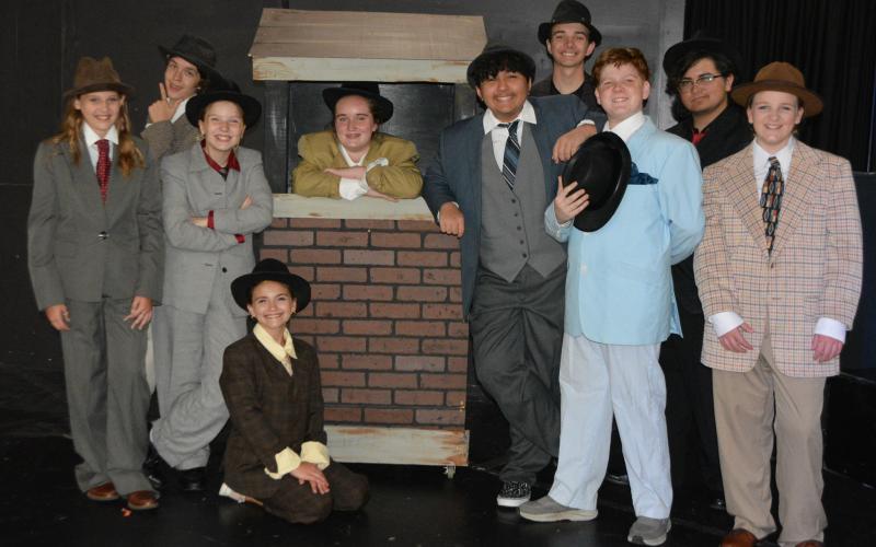 Emmry Braid, from left, Alex Higginbotham, Desiree Williams, Madeline Gillespie, Eliza Sears, Jayson McLaughlin, Nathan Hauenstein, Elijah Kessler, Dylan Carter and Isabelle Crenshaw will perform in Saltwater Performing Arts’ “Guys and Dolls” at The Warehouse in Kingsland.