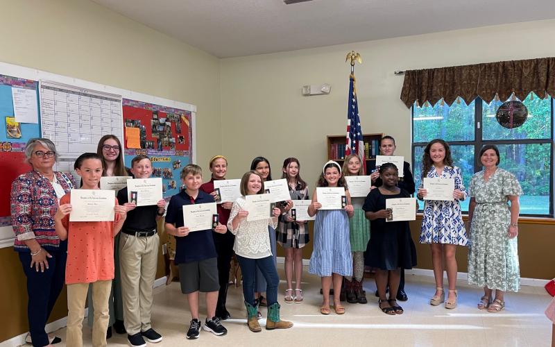 Award recipients of the Earl of Camden Chapter of the Daughters of the America Revolution included, front row, from left, Liam Ross (Crooked River Elementary School), Grant Garman (St. Marys Middle School), Logan MacRae (Woodbine Elementary School), Patsy Wells (Matilda Harris Elementary School), Laney Grace Blount (Mary Lee Clark Elementary School) and Kaylah Anderson (Kingsland Elementary School). Back row: Nanette Moreira, Addison Mulhair (Camden Middle School), Liliana Spencer (St. Marys Elementary Scho