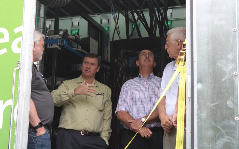 Visitors to the Hydrogen Energy Road Show on Friday tour an 18-wheel truck that is powered completely by hydrogen energy.