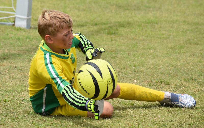 Blake Ludwig stretches for a save at the Challenger soccer camp. (Andy Diffenderfer, Tribune &amp; Georgian)