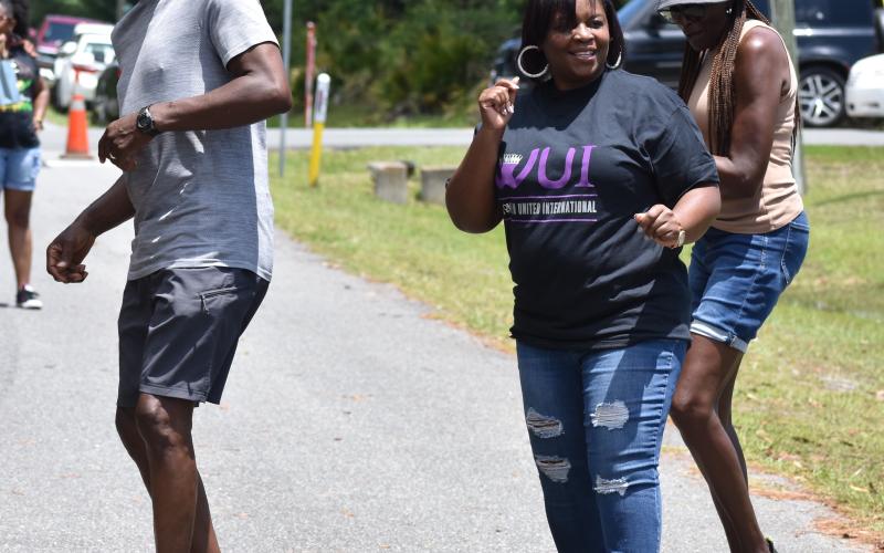 Clifton Herbert Mitchell, Kingsland Councilwoman Kristy Chance and Peggy Kennedy dance to the music.