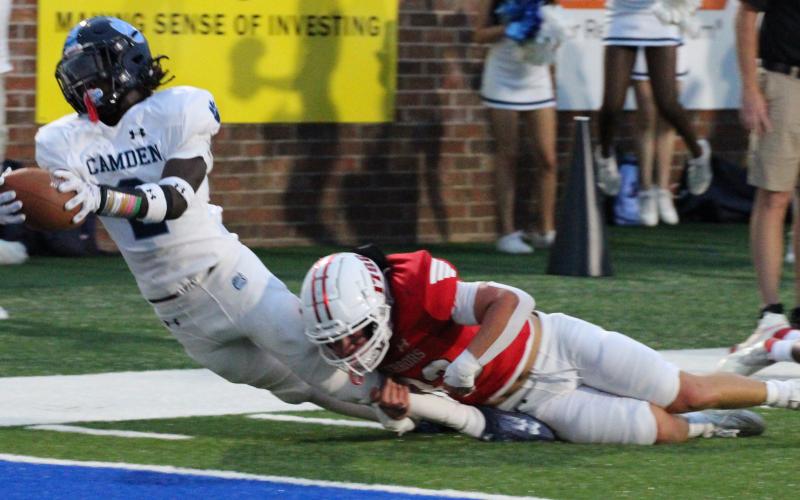 Ja’Marley Riddle stretches for the goal line against Glynn Academy. The senior scored three touchdowns in the Wildcats’ romp last Friday, two rushing and another receiving. (Scott J. Bryan, Tribune &amp; Georgian)