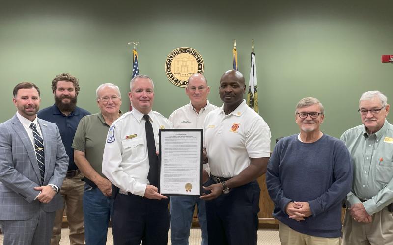 Administrator Shawn Boatright, Camden County Commissioners Trevor Readdick and Lannie Brant, Fire Safety Specialist Lt. Chris Goebel, Camden County Board of Commissioners Chairman Ben Casey, Fire Chief Terry Smith, and Commissioners Martin Turner and Commissioner Jim Goodman celebrate Fire Prevention Week.