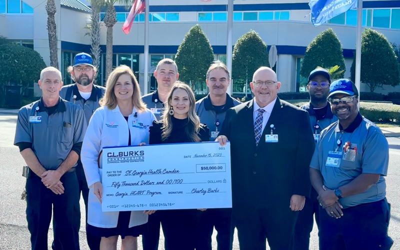 C.L. Burks Construction redirected $50,000 to the Southeast Georgia Health System Camden Campus through the Georgia HEART Hospital Program. Front row, from left are Southeast Georgia Health System Camden Campus Chief of Staff Dr. Janise H. Whitesell, C.L. Burks Construction Marketing Director Angela Daniels, hospital Vice President and Administrator Glenn Gann and Wes Mitchell, part of the hospital’s Facilities team. Back row: Hospital Facilities team members Craig Conyers, Jeff Boone, Christopher Woody, Mi