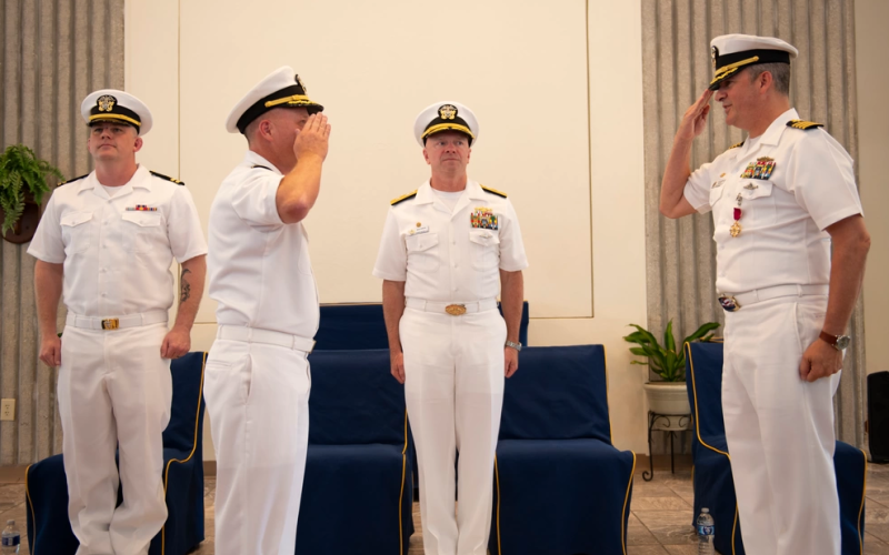 Capt. Gabriel A. Anseeuw, right, relinquishes command of Submarine Squadron Sixteen to Capt. Eric Cole, left, during a change of command ceremony aboard Naval Submarine Base Kings Bay.