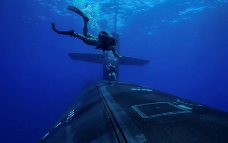 Marines from the Second Force Reconnaissance Company conduct dive operations with Ohio-class guided-missile submarine USS Georgia (SSGN 729) while underway in the Mediterranean Sea in July.