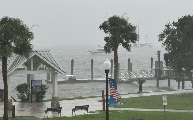 Bert Guy | Special to the Tribune &amp; Georgian Heavy winds and driving rain pummel downtown St. Marys. The photo was taken from the balcony of the Riverview Hotel.