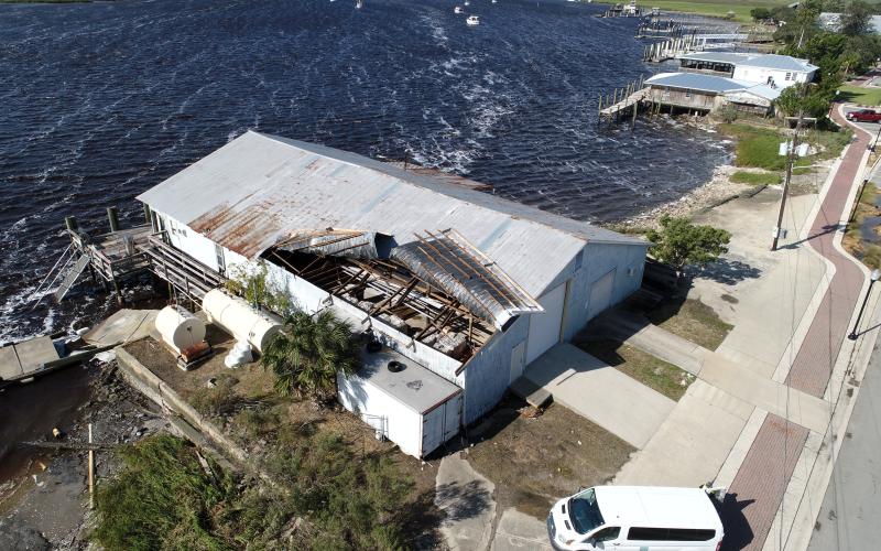 The roof of the building at Lang’s Marina received substantial damage from Hurricane Helene on Friday morning. Thousands of Camden County residents were without power through most of the weekend. (Michael Lewis Aerial Photography | For the Tribune &amp; Georgian)