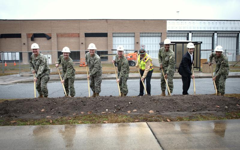From left, Capt. Chris Bohner, commanding officer, Naval Submarine Base Kings Bay; Capt. Mark Parrella, program manager, Columbia Class SSBN Program (PMS 397); Capt. Miguel Dieguez, commanding officer, Naval Facilities Engineering Systems Command (NAVFAC) Southeast; Rear Adm. Robert E. Wirth, commander, Submarine Group TEN; George Rogers, CEO, RQ Construction; Capt. Michael Paisant, commanding officer, Trident Refit Facility, Kings Bay; Lee Hopson, vice president of federal programs for AECOM; and Capt. Jua