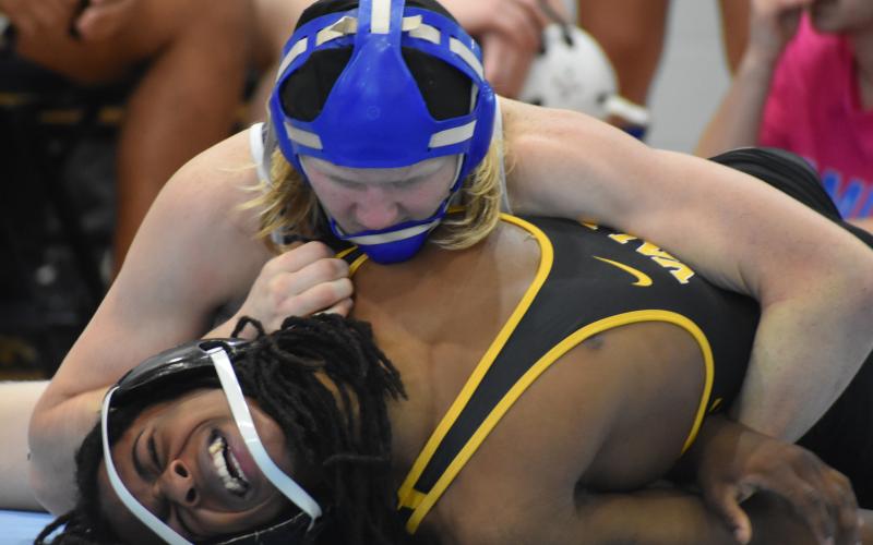 Camden County High School’s Hunter Prosen, top, wrestles against Valdosta’s Elijah Barnes during the Region 1-6A dual tournament in Kingsland.