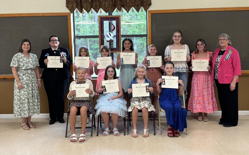 Winners of the Daughters of the American Revolution’s awards were, front row, from left, Mary Lee Clark Elementary’s Libby Bubp, Sugarmill Elementary’s Silje Sherven, Crooked River Elementary’s Charlotte Cimaglia and Matilda Harris Elementary’s Evangeline Everett. Back row: Earl of Camden’s Ardith Sweatt, Camden County High School JROTC’s Brooke Salazar, David L. Rainer Elementary’s Kinley Wilson, Woodbine Elementary’s Charlotte Horn, St. Marys Middle School’s Windsor Lane Weaver, Mamie Lou Gross Elementary