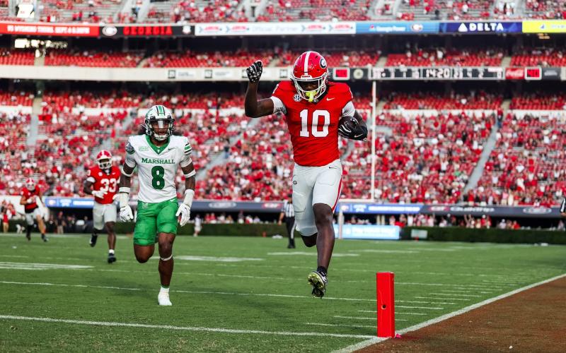Georgia freshman Elyiss Williams races into the end zone for 23-yard touchdown reception against Marshall on Saturday. Williams, a 2025 Camden County High School graduate, was playing in his first collegiate game. The Bulldogs won 45-7. (Photo by the University of Georgia)