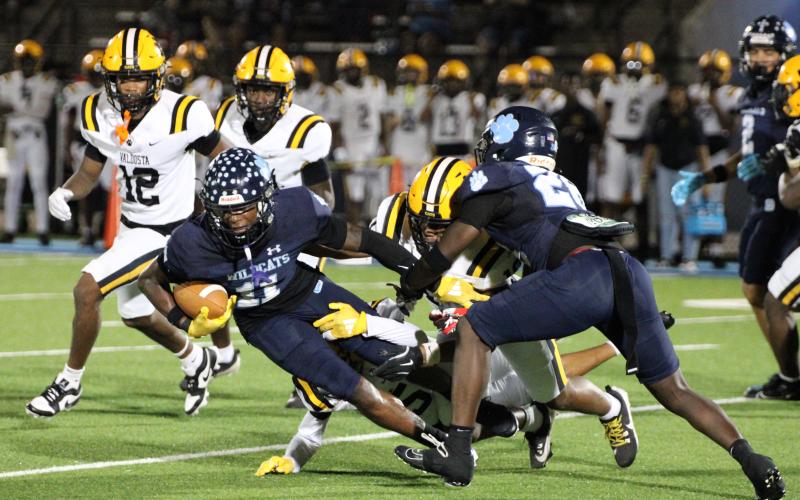 Camden County’s David Coleman falls forward for positive yardage Friday during a kickoff return during the Wildcats’ 63-19 loss to Valdosta at Chris Gilman Stadium.
