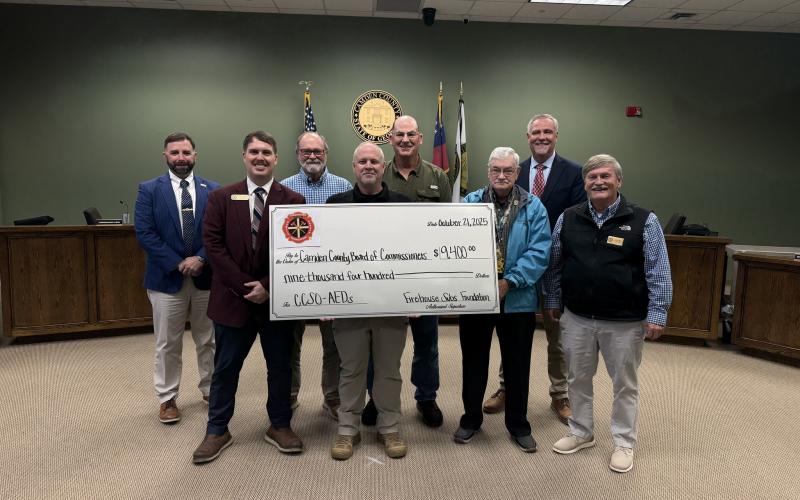 Camden County Sheriff Kevin Chaney, center, and the Camden County Board of Commissioners recently received a $9,400 grant from the Firehouse Subs Public Safety Foundation for eight Philips Onsite AEDs.