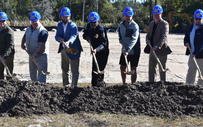 From left, Bryan James, B. James Construction (general contractor); Benjamin Starks, senior project manager, Jericho Design Group (architect); Kingsland Mayor Grayson Day; Kingsland Police Chief Rickey Evans; Alex Blount, Kingsland City Council; Paul Chamberlin, Kingsland City Council; and Kingsland City Manager Lee Spell break ground on the new city police headquarters.