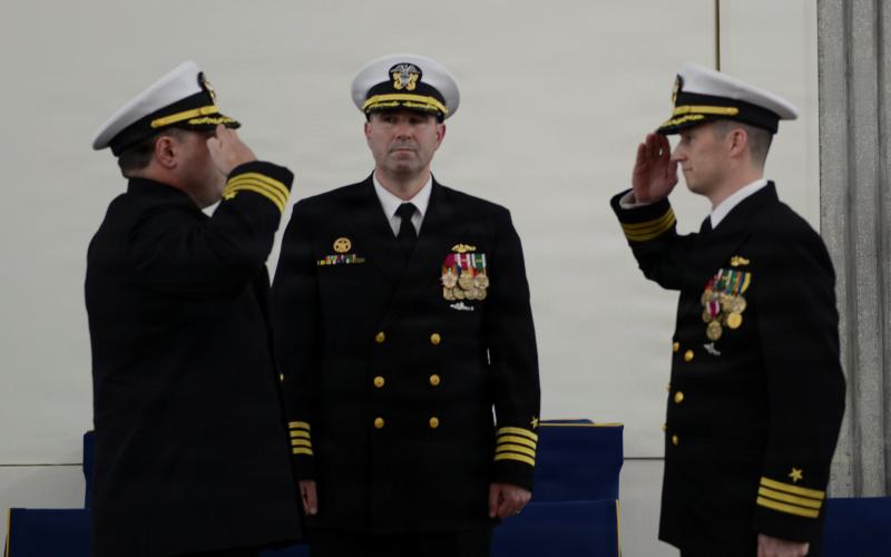 U.S. Navy Cmdr. Brian Ross, right, relinquishes command of the Ohio-class ballistic missile submarine, USS West Virginia (Gold), to Cmdr. Scott J. Tedrick during a change of command ceremony at Naval Submarine Base Kings Bay.