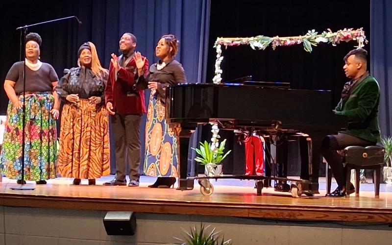 The Duke Fisher Singers perform Tuesday morning during a Thiokol plant explosion memorial at Camden County High School’s auditorium.