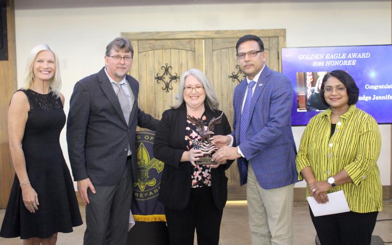 Camden County Chief Magistrate Judge Jennifer Lewis, center, accepts the Golden Eagle Award on Thursday, May 14 at the Santa Maria Venue in St. Marys. The Golden Eagle award is presented each year by the Scouting America Coastal Council to a person who has contributed immensely to the scouting organization’s mission and goals. With Lewis, from left, are Alison Shores, Anthony Kicklighter, CB Yadav and Sugar Yadav. To view more photos, see Page 15 and visit tribune-georgian.smugmug.com.