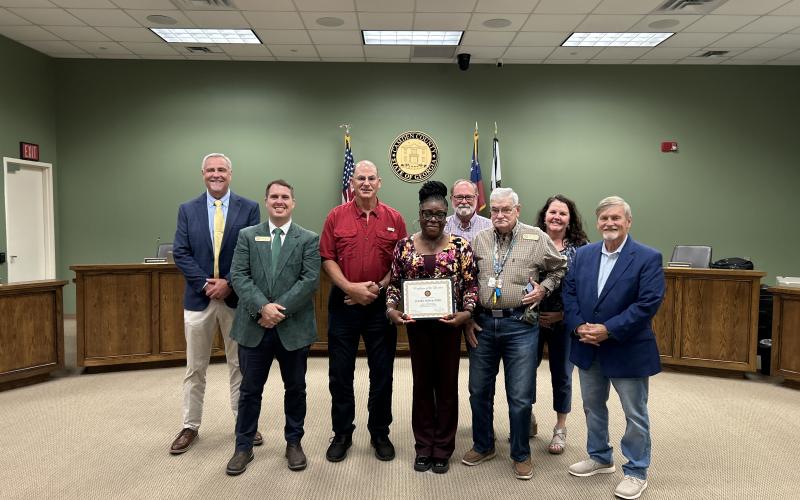 Frankie Hillery-Miller, center, was recently honored as the Camden County Board of Commissioners’ Employee of the Quarter. With Hillery-Miller are, from left, Interim County Administrator Joey Yacobacci, Commissioners Cody Smith and Ben Casey, Chairman Robbie Cheek, Commissioner Jim Goodman, Interim Deputy County Administrator Shannon Nettles and Commissioner Martin Turner